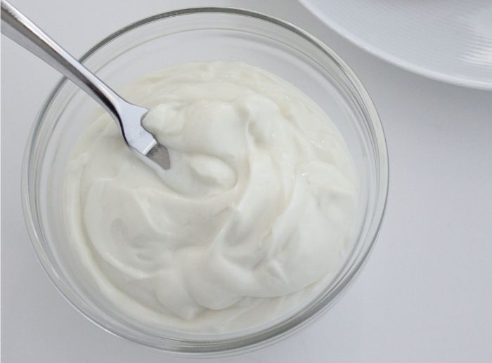 mustard-free-mayo Homemade dairy free mayonnaise without mustard in a glass bowl