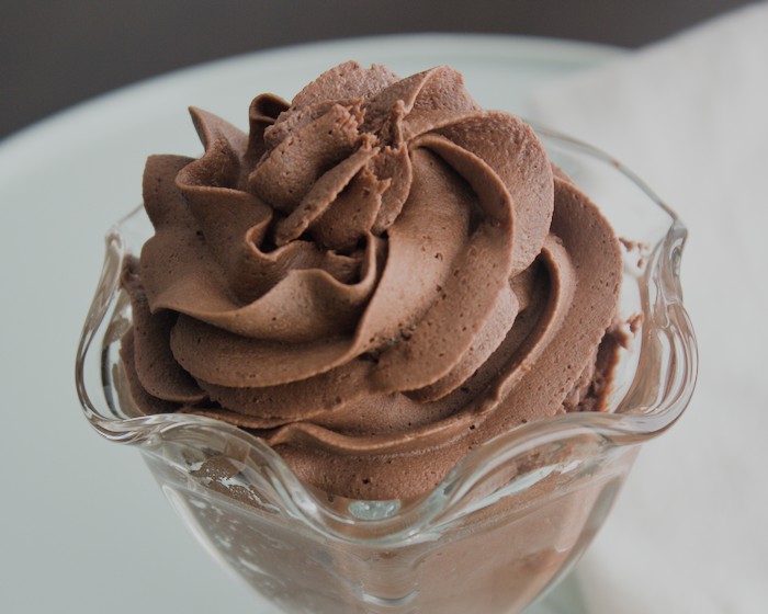 Dairy free chocolate frosting without butter piped into a glass dessert dish