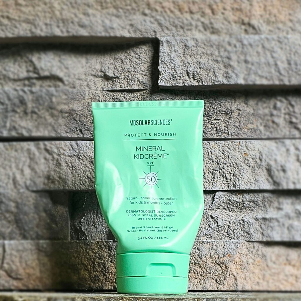 MD Solar Sciences Mineral Kidcreme on a stone shelf